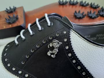 FootJoy style 51797: Saddle golf shoe, shrunken and boarded calf. Pebbled White/Smooth Black saddle