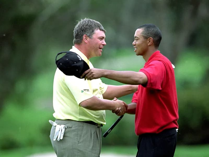 Darren Clarke and Tiger Woods shake hands on the green at the end of their match